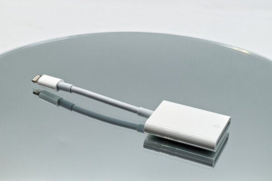 Bologna - Italy - February 26, 2022: Sd card reader to lightning connector for Apple devices