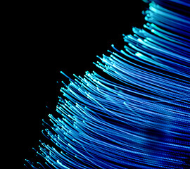 Light in transformation. Illustration of beams of light against a dark background.