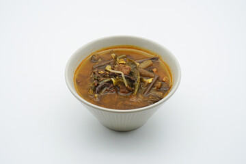 Beef Yukgaejang in a bowl on a white background