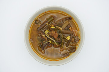 Beef Yukgaejang in a bowl on a white background