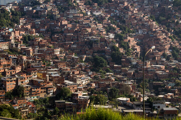 Traveling through Venezuela, the architecture of Petare, a Caracas neighborhood with red brick...