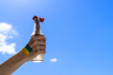 female hand-painted in Ukraine flag colors yellow-blue in a fight with a molotov cocktail. Stop war between Russia and Ukraine. , power of Ukraine, strength and power