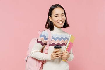 Teen student girl of Asian ethnicity wearing sweater backpack hold books hold takeaway delivery...
