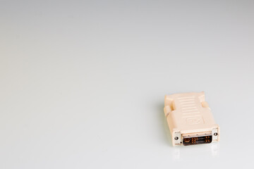 DVI-VGA adapter on a white background with side lighting