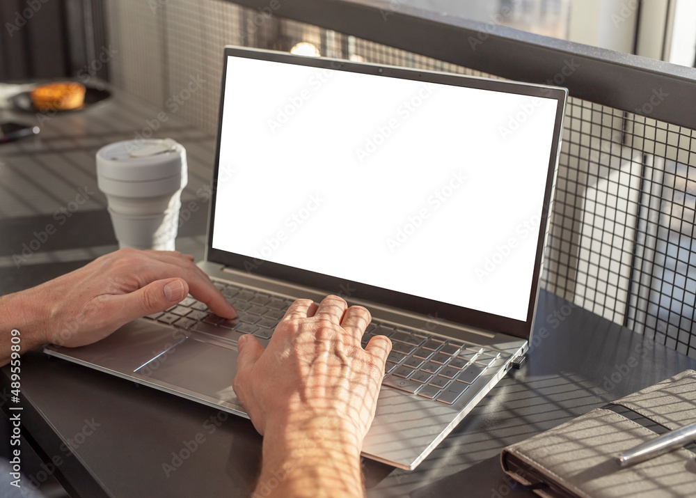 Poster Laptop mockup with blank screen. Woman hands closeup typing on keyboard. Using computer for work, distant education, information search, social communication. High quality photo