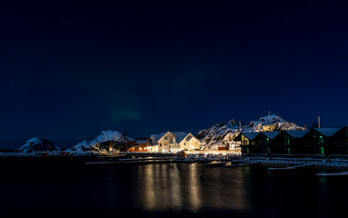 northern lights above village Hamn on Senja island in Norway on a clear cold winter day