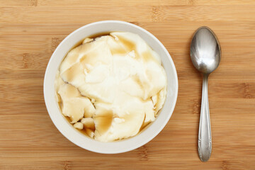 Wedang Tahu or Kembang Tahu, traditional dessert made of soybean pudding with palm sugar and ginger syrup