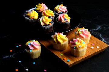 Chocolate and vanilla mini cupcakes, with space for text.