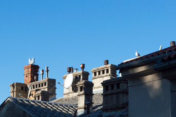 Detail of rooftops with old chimneys, in city Rijeka, Croatia