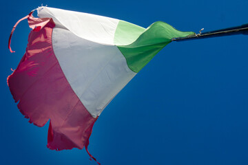 The Italian flag worn by the wind