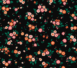 Fototapeta na wymiar Seamless floral pattern. Ditsy background of small orange flowers. Vector pattern. Elegant template for fashion prints. Black background. Summer and spring motifs.