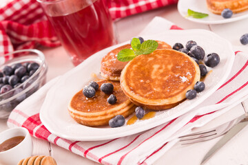 Pancakes with blueberries and chocolate cream.