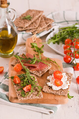 Crispy rye bread with sesame seeds, ham and cottage cheese.