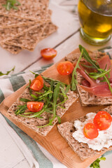Crispy rye bread with sesame seeds, ham and cottage cheese.
