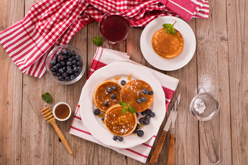 Pancakes with blueberries and chocolate cream.