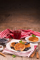 Pancakes with blueberries and chocolate cream.