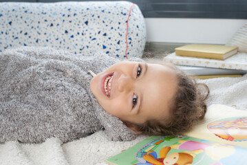 CHILD READING A STORY