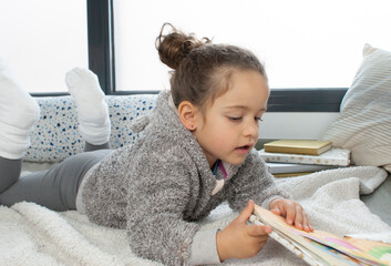 CHILD READING A STORY
