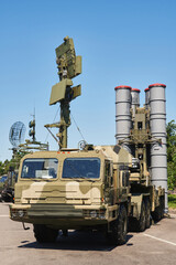 military complex anti-aircraft missile system. weapons of mass destruction against the blue sky with communication antenna and radar