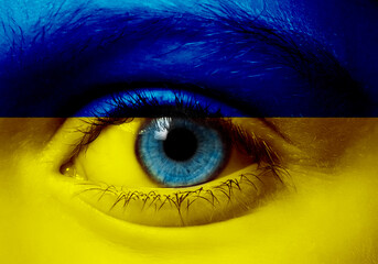 ukraine crisis concept child face in ukraine flag colors