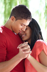 Feeling the romance. Shot of an affectionate young couple holding hands outdoors.