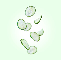 Cucumbers are flying in the air. Levitation on green background