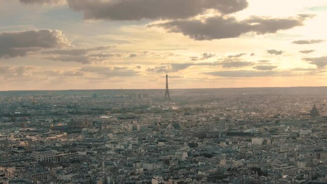 Aerial Paris beautiful sunset sky view of Tour Eiffel Tower and Parisian buildings architecture rooftops 