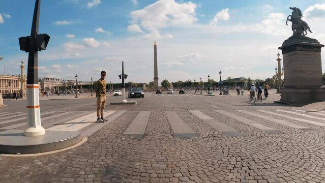 Point of view car driving towards Place de la Concorde Paris street square architecture view, Luxor Obelisk view Paris France 