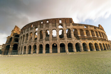 Naklejka na ściany i meble Colosseum at sunset. Rome a city full of history with numerous monuments