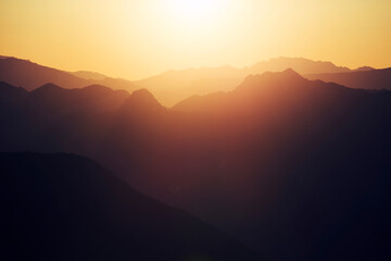 sunset in the mountains with lens glare