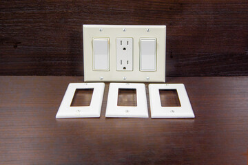 Switches with a socket on one board and spare covers