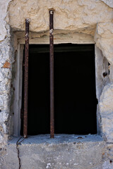 barred window of a typical construction of the Sassi of Matera