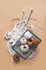 Flat lay composition threads for knitting cotton.Handmade zero waste, upcycling, new concept employment opportunities small business.Hobby knitting and needlework for mental health. Knitted background