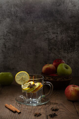 Beautiful photos of a drink made from colorful fruits and spices in a glass cup on a wooden table.
