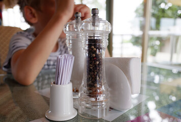 glass pepper mill in a restaurant on the table