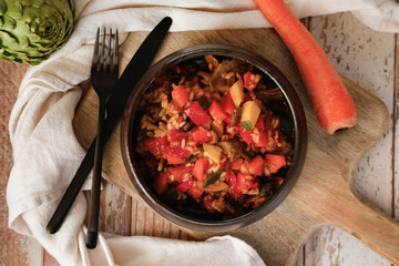 Vegetable rice with beans, zucchini, carrot, red pepper and artichokes. Typical Mediterranean food 