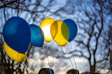 Blue and yellow balloons at a peace protest