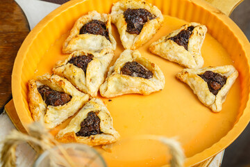 Gomentash biscuits for Purim holiday fresh in a baking dish.
