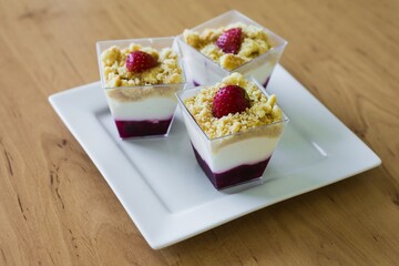 Detail of Muffin in a basket on a ceramic plate placed on a table.