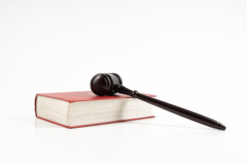 Law concept - law book with a wooden judge's gavel on table. Copy space for text