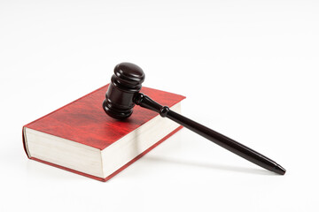 Law concept - law book with a wooden judge's gavel on table. Copy space for text