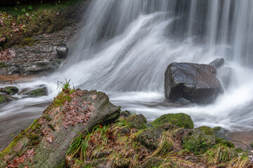 Beautiful mountain waterfall in a wild and isolated valley during the winters.
