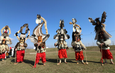 Obraz na płótnie Canvas Masquerade festival in Elin Pelin, Bulgaria. People with mask called Kukeri dance and perform to scare the evil spirits. 