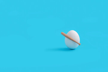 Creative Easter concept with egg with baseball bat