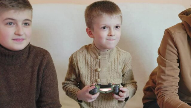 children playing on the console with joysticks in ruhs close-up