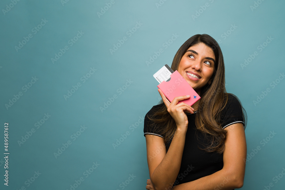 Wall mural latin woman thinking about her trip