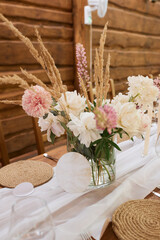 Wedding Party Table Decoration with Beautiful Flowers and Wood