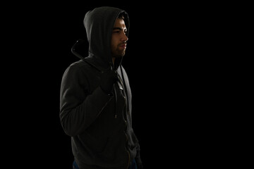 Side view of a burglar with a crowbar