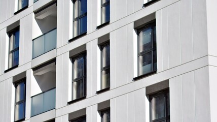 Fragment of modern residential apartment with flat buildings exterior. Detail of new luxury house and home complex.  