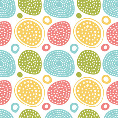Seamless background with abstract ornament with colored circles and hearts.